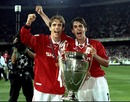 Phil and Gary Neville celebrate winning the Champions League