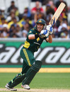 Michael Hussey works the ball during his unbeaten 71