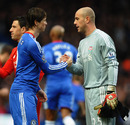 Former team-mates Fernando Torres and Pepe Reina embrace