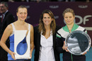 Petra Kvitova poses with beaten finalist Kim Clijsters
