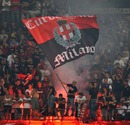 AC Milan's supporters wave a flag