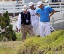 Dustin Johnson looks down at the ground