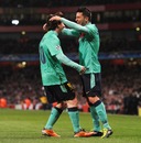 Lionel Messi and David Villa celebrate after combining for the opening goal