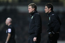 Burnley boss Eddie Howe and assistant manager Jason Tindall look on