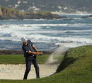 Dustin Johnson hits a crucial bunker shot on the 72nd hole