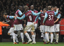 Winston Reid is congratulated by his team-mates after scoring