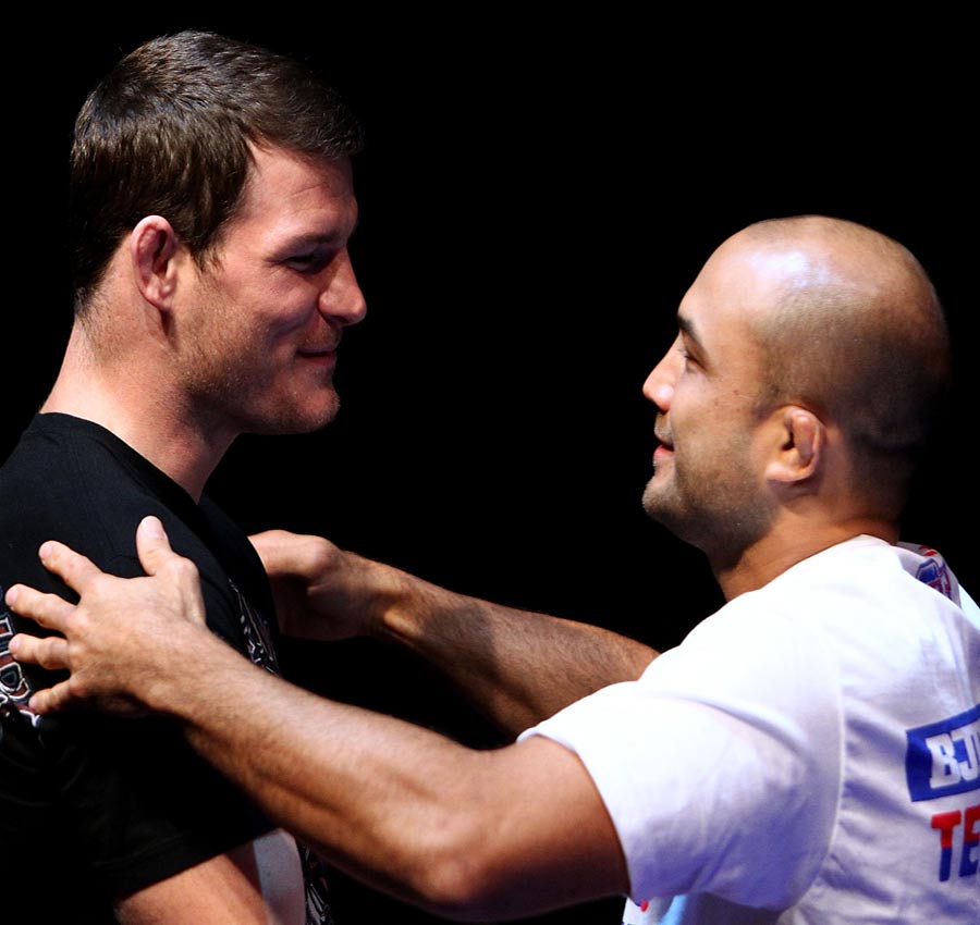 Michael Bisping and BJ Penn embrace during an Open Workout