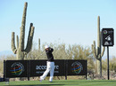 Rickie Fowler tees off during practice