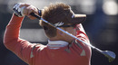 Ian Poulter hits a wedge during practice