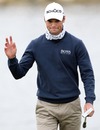 Martin Kaymer waves to fans after putting on the third hole