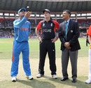 MS Dhoni tosses the coin as Andrew Strauss looks on