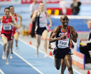 Mo Farah crosses the line in first place