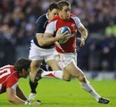 Wales' Shane Williams breaches the Scotland defence