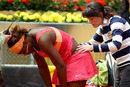 Serena Williams receives treatment on a back injury