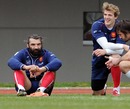 Sebastien Chabal speaks with team-mate Julien Pierre during a training session