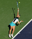 Kim Clijsters sends down a serve