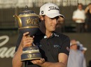 Nick Watney poses with the trophy