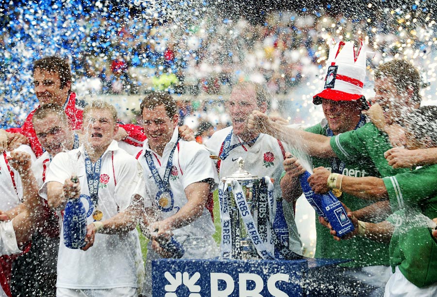 The England team celebrate victory