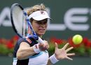 Kim Clijsters grimaces after hitting a forehand