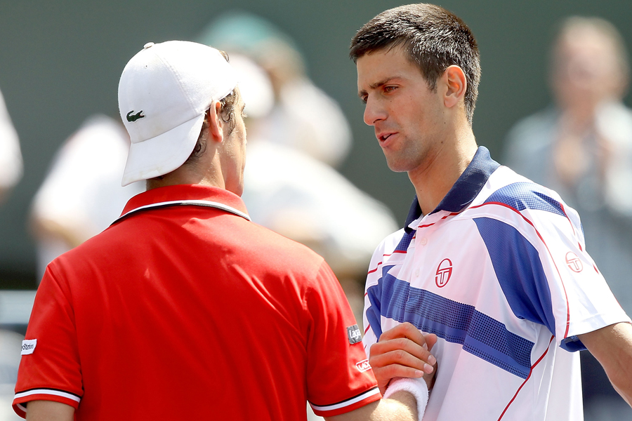 Novak Djokovic is congratulated by Richard Gasquet