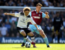 Luka Modric and Scott Parker tussle for the ball