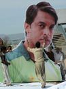 Labourers erect a giant billboard of Shoaib Akhtar who will retire after the World Cup