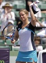 Kim Clijsters waves to the crowd after defeating Anastasiya Yakimova