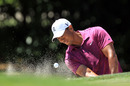 Tiger Woods escapes from a greenside bunker