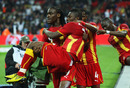 Asamoah Gyan celebrates his goal with team-mates