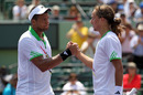 Alexandr Dolgopolov is congratulated by Jo-Wilfried Tsonga on his victory