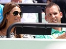 Sergio Garcia and Stacey Gardner, the wife of tennis player Mardy Fish, watch the match
