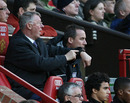 Sir Alex Ferguson points to his watch