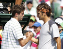 Roger Federer accepts victory from Gilles Simon