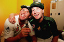 Michael Clarke and Shane Warne pose with the replica of the Ashes trophy
