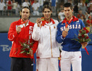 Fernando Gonzalez, Rafael Nadal and Novak Djokovic show off their medals