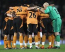 Wolves players form a huddle prior to playing Manchester United