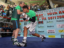 Amir Khan spars with his trainer Freddie Roach during a media workout