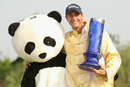 Nicolas Colsaerts celebrates with the China Open mascot