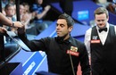 Ronnie O'Sullivan signs an autograph after his victory