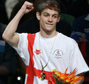 Stephen Smith celebrates his gold medal in the featherweight 57kg