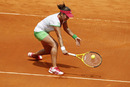 Anabel Medina Garrigues stoops to reach the ball