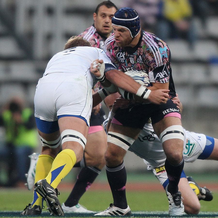 Stade Francais flanker James Haskell holds off Clermont second-row Thibault Privat