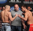 Georges St-Pierre and Jake Shields pose after their weigh-in