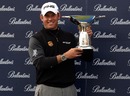 Lee Westwood poses with the trophy 