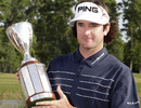 Bubba Watson poses with the winner's trophy