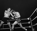 Henry Cooper and Joe Bugner trade blows in their title bout