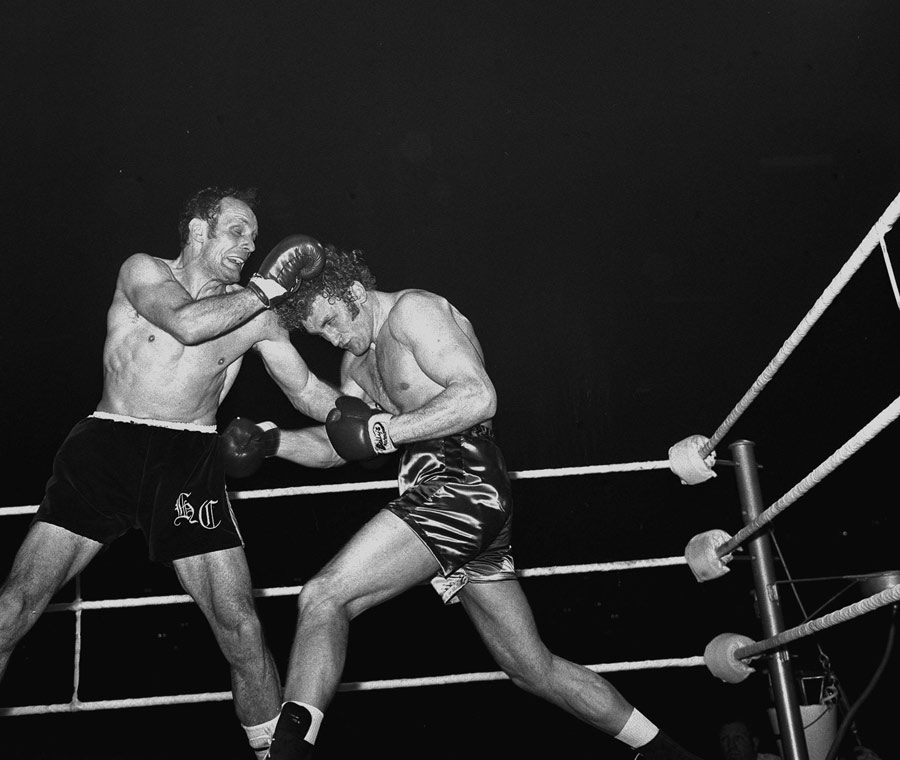 Henry Cooper and Joe Bugner trade blows in their title bout
