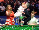 John Higgins celebrates with his wife Denise and children Pierce and Claudia 