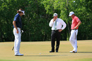 Webb Simpson talks to a tournament official