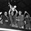 Bobby Charlton holds aloft the European Cup